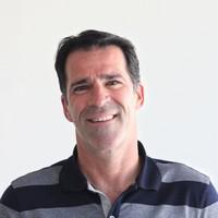 Mike Small, CEO of Hoopla, smiling for a photo.