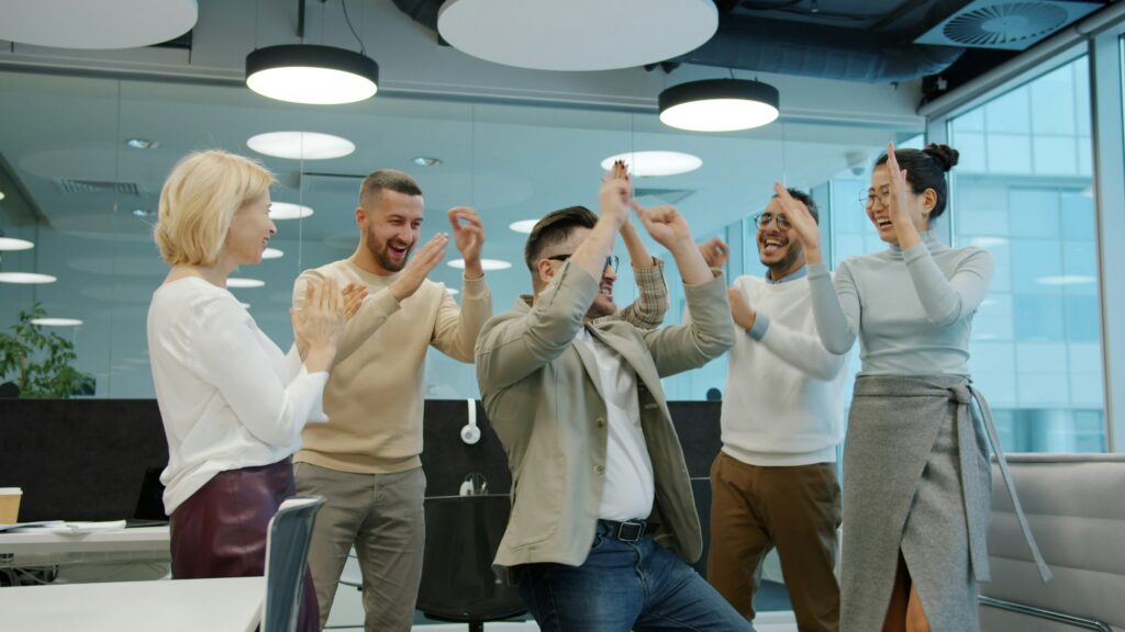 Team celebrating a gamification win at work.
